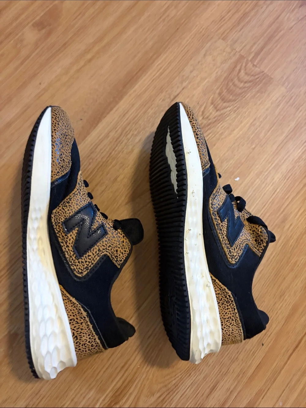 New Balance women’s Black and Tan Leopard-Print Sneakers